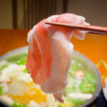 A single bite of Kurobuta shabu-shabu pork