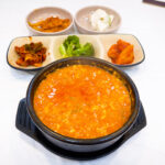 Sundubu-jjigae with Korean side dishes in Mokpo
