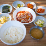 A plate of the famous crab meat dish, served with side dishes.