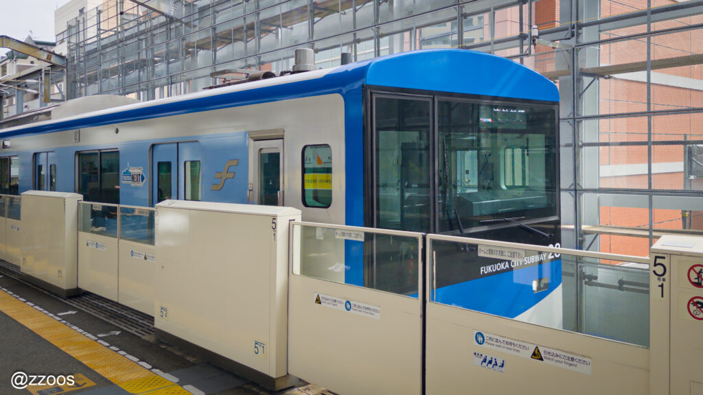 A Fukuoka subway train in blue and white