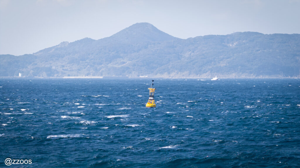 A buoy floating on rough waves.