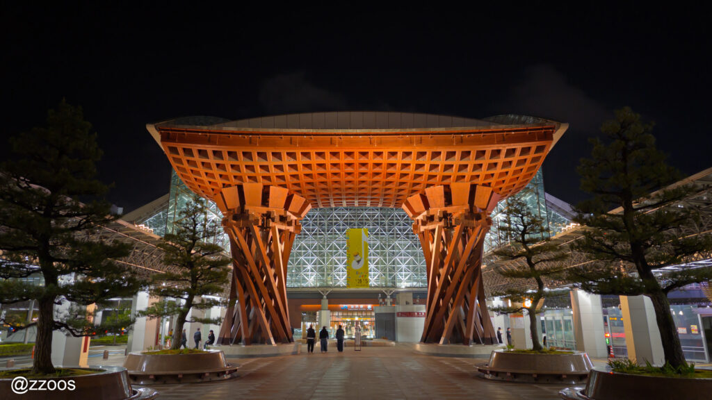 Tsuzumi-mon Gate and Motenashi Dome illuminated at night at Kanazawa Station