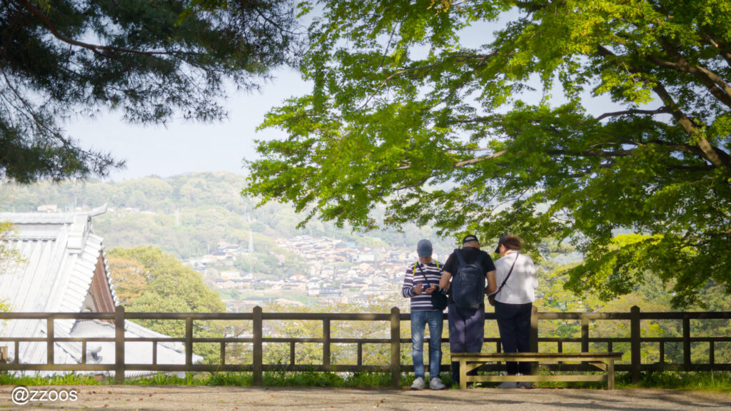 Three family members looking at the scenery at Kanazawa Castle.