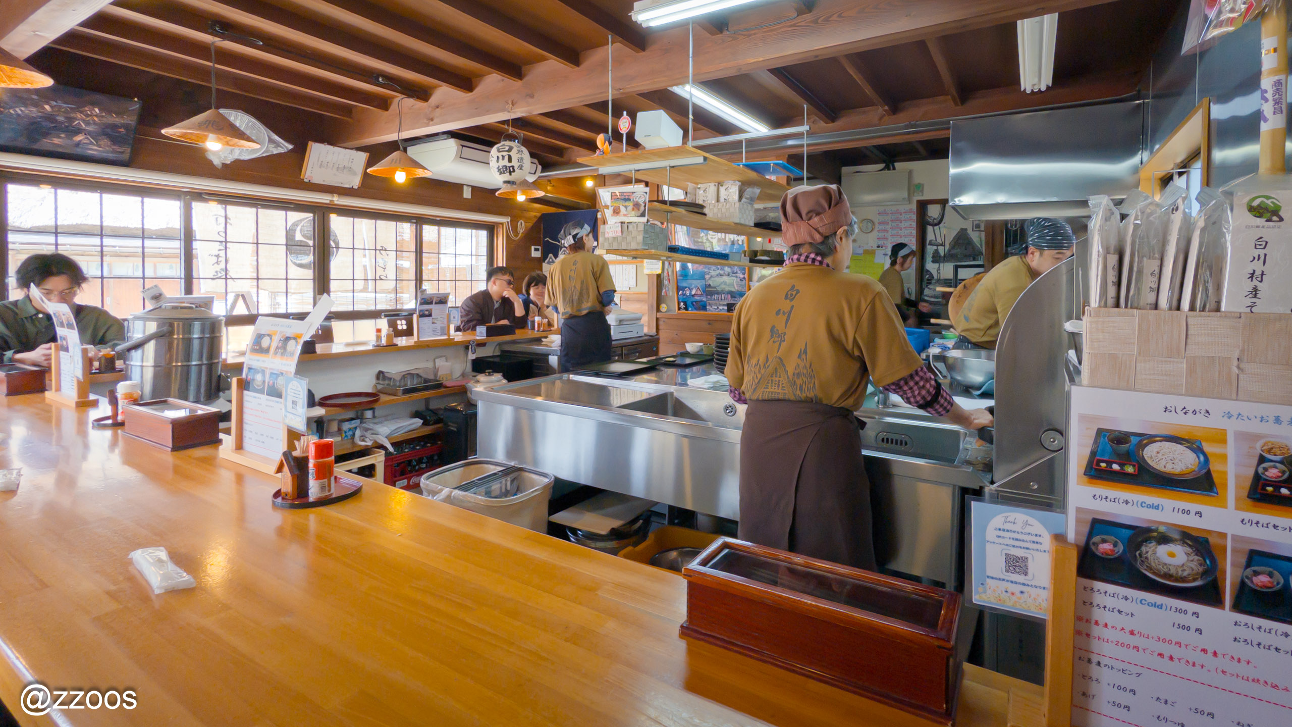 The clean interior of Nomura soba restaurant with the kitchen in view