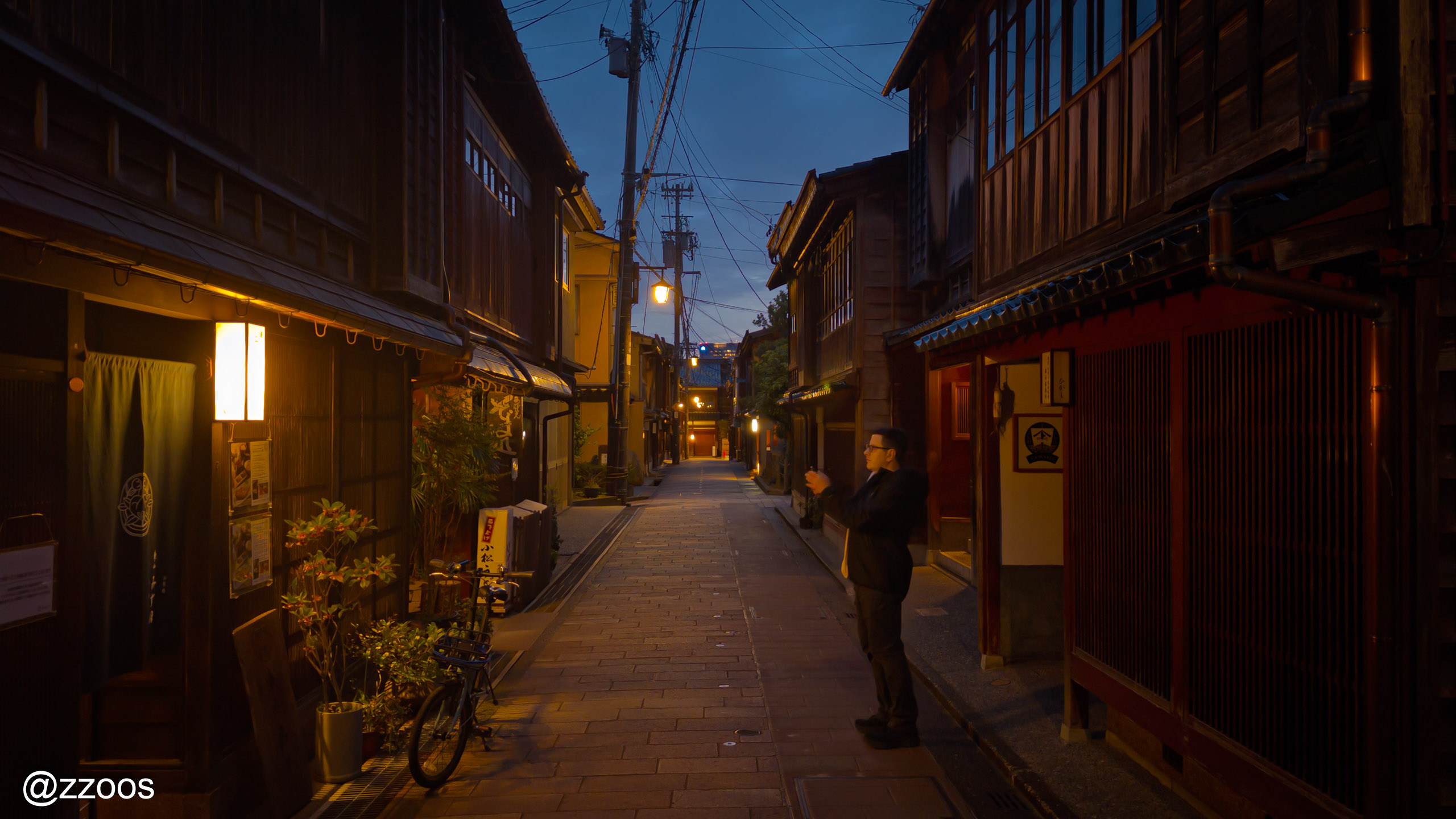 Foreign visitors taking photos in the streets of Higashi Chaya