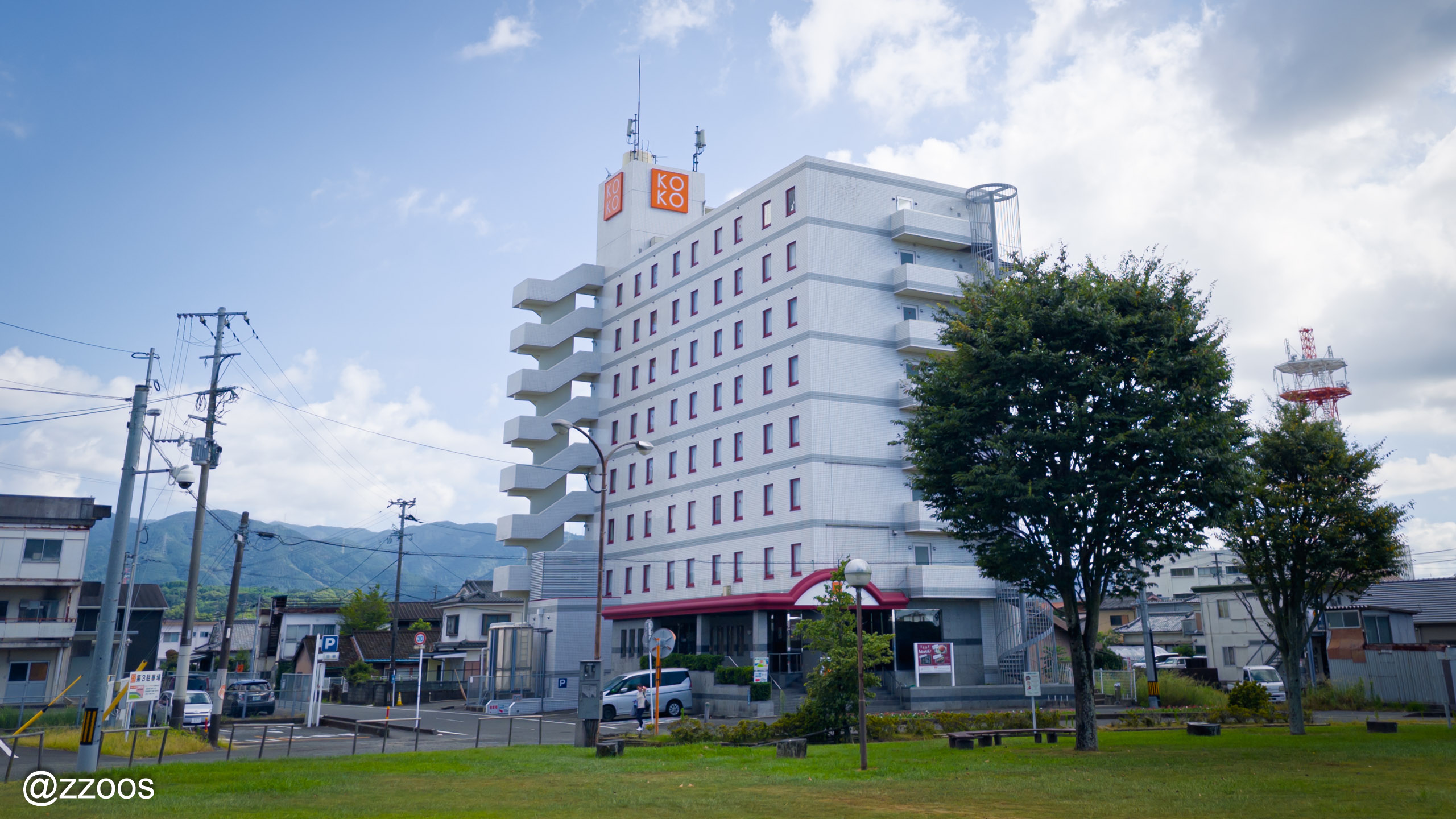 KOKO STAY Izumi seen from Izumi Station plaza during the day