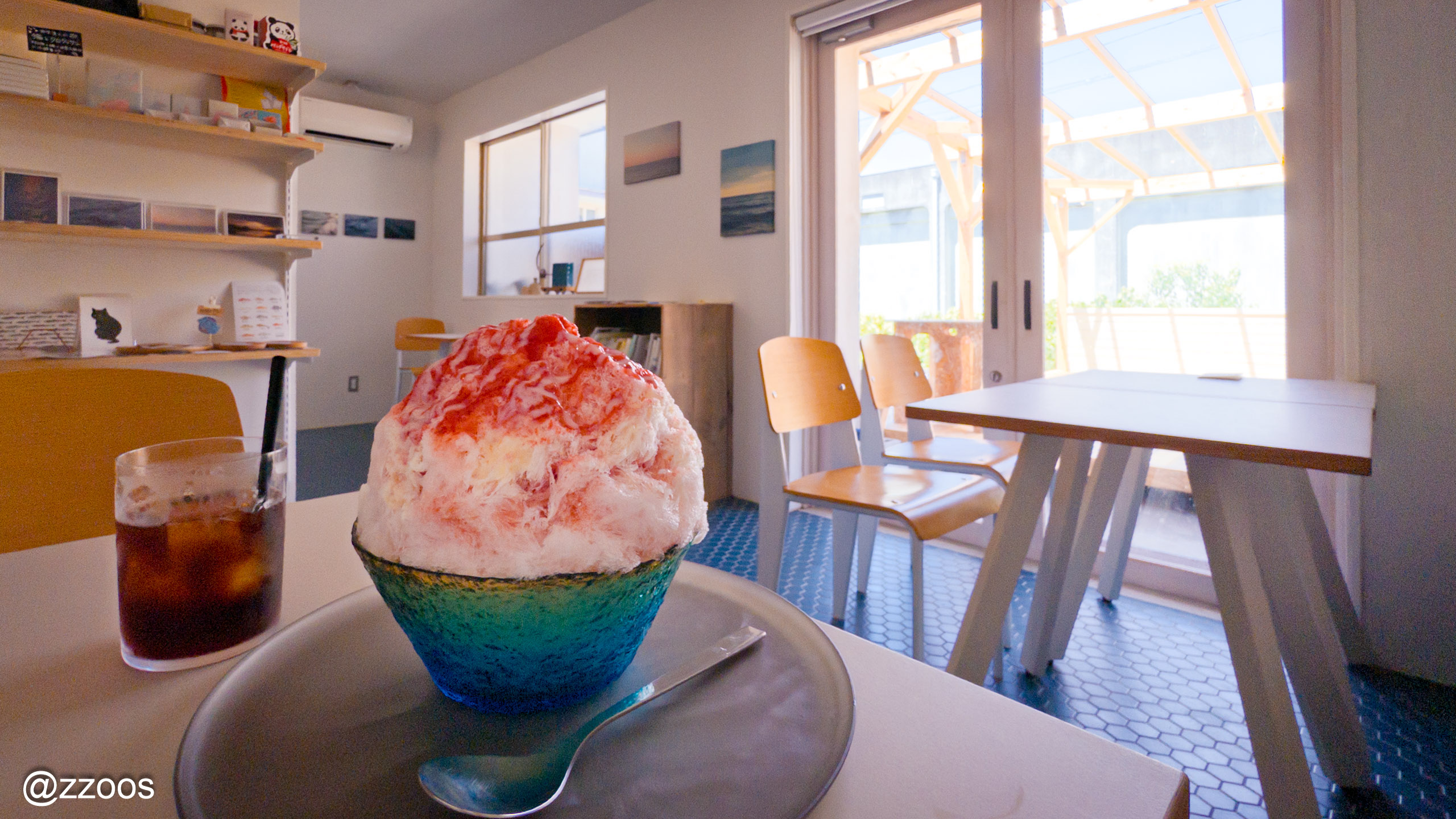 Condensed milk shaved ice topped with Akune strawberries, with an iced coffee