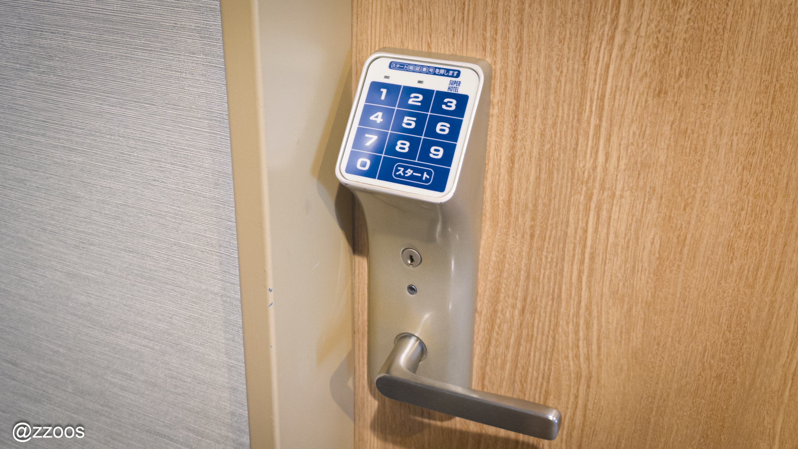A push-button door lock on a guest room door