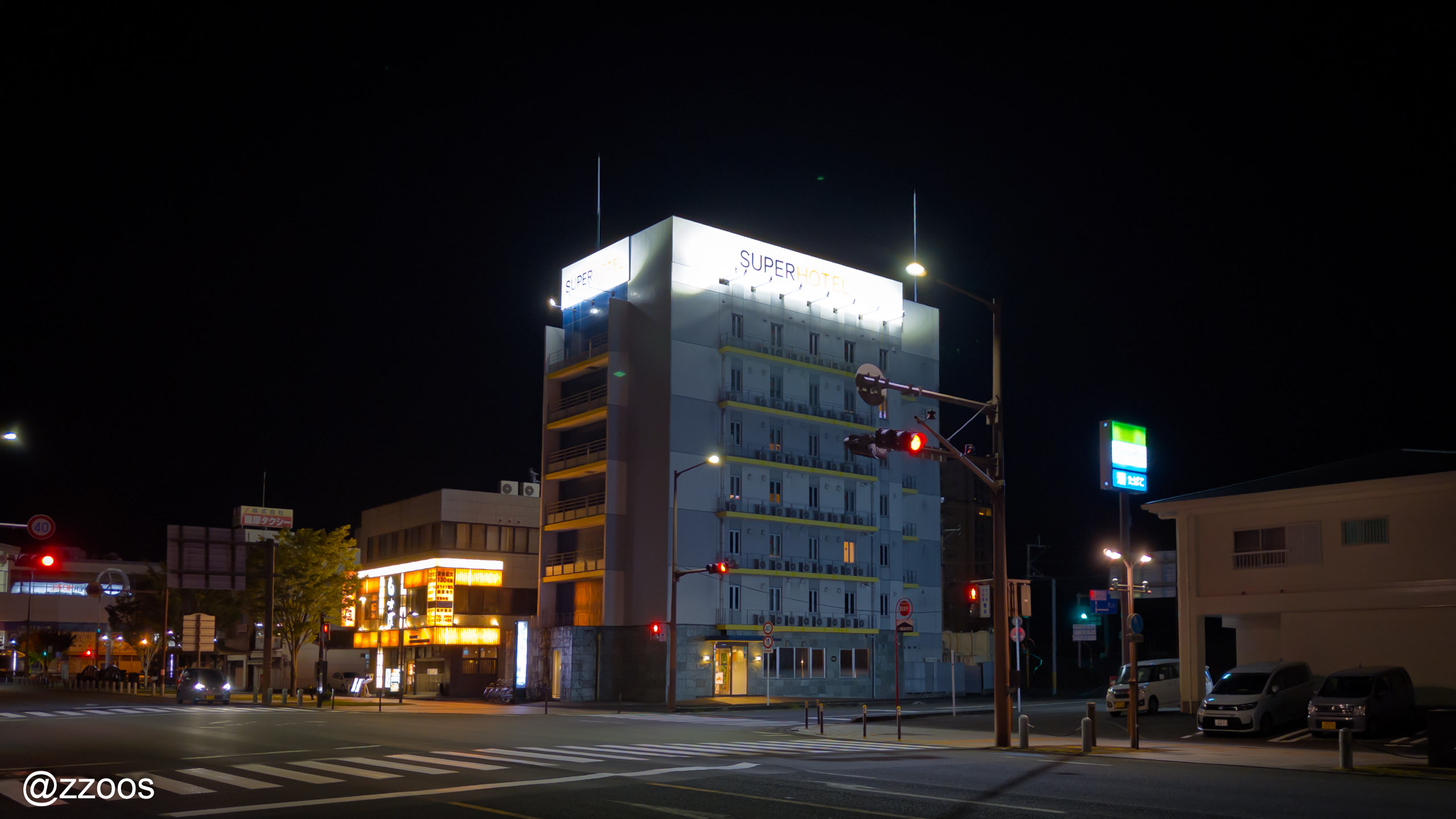 Super Hotel Satsumasendai at night, seen from a distance