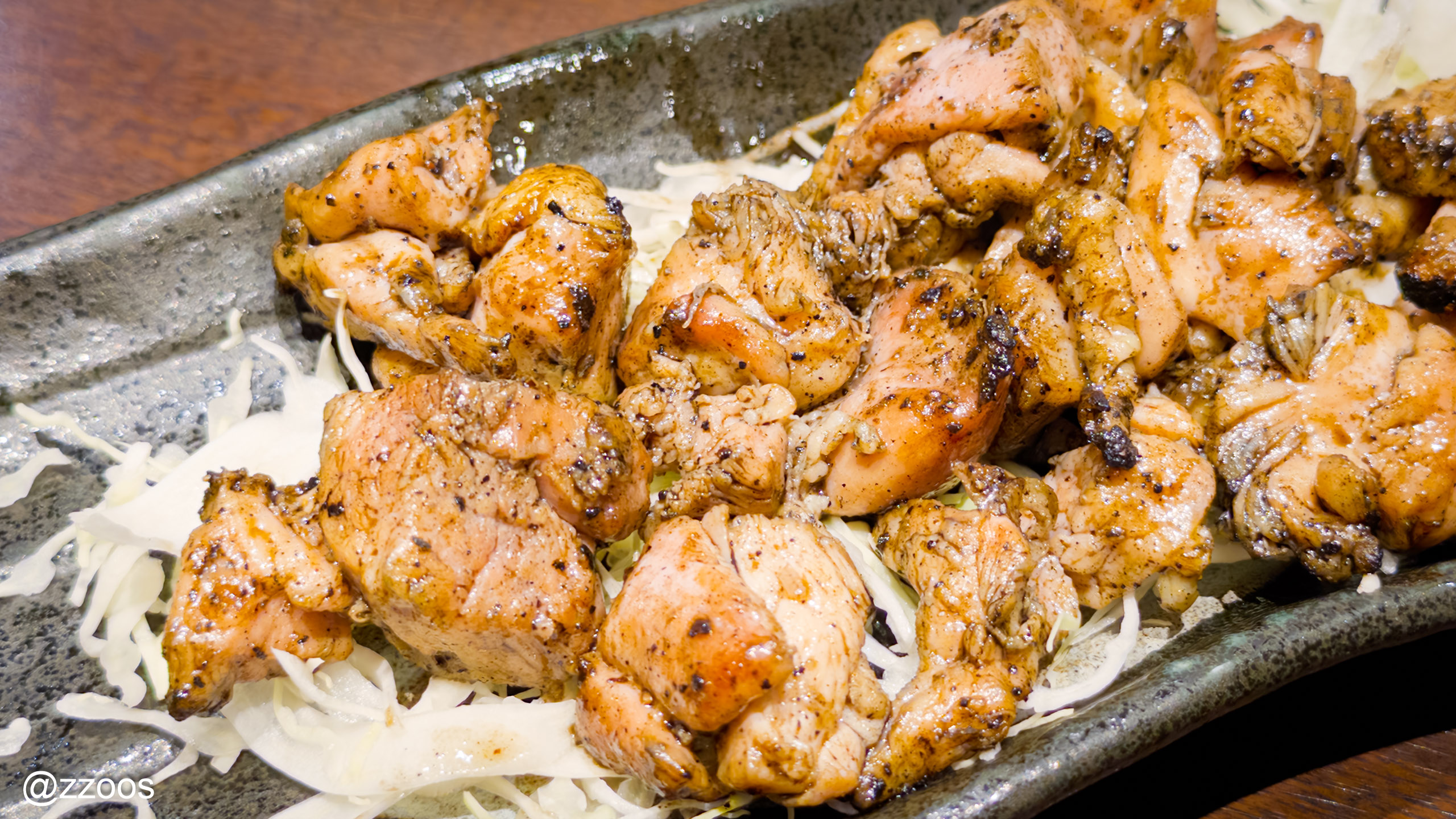 Charred chicken thigh grilled over an open flame, momo no hibashirayaki