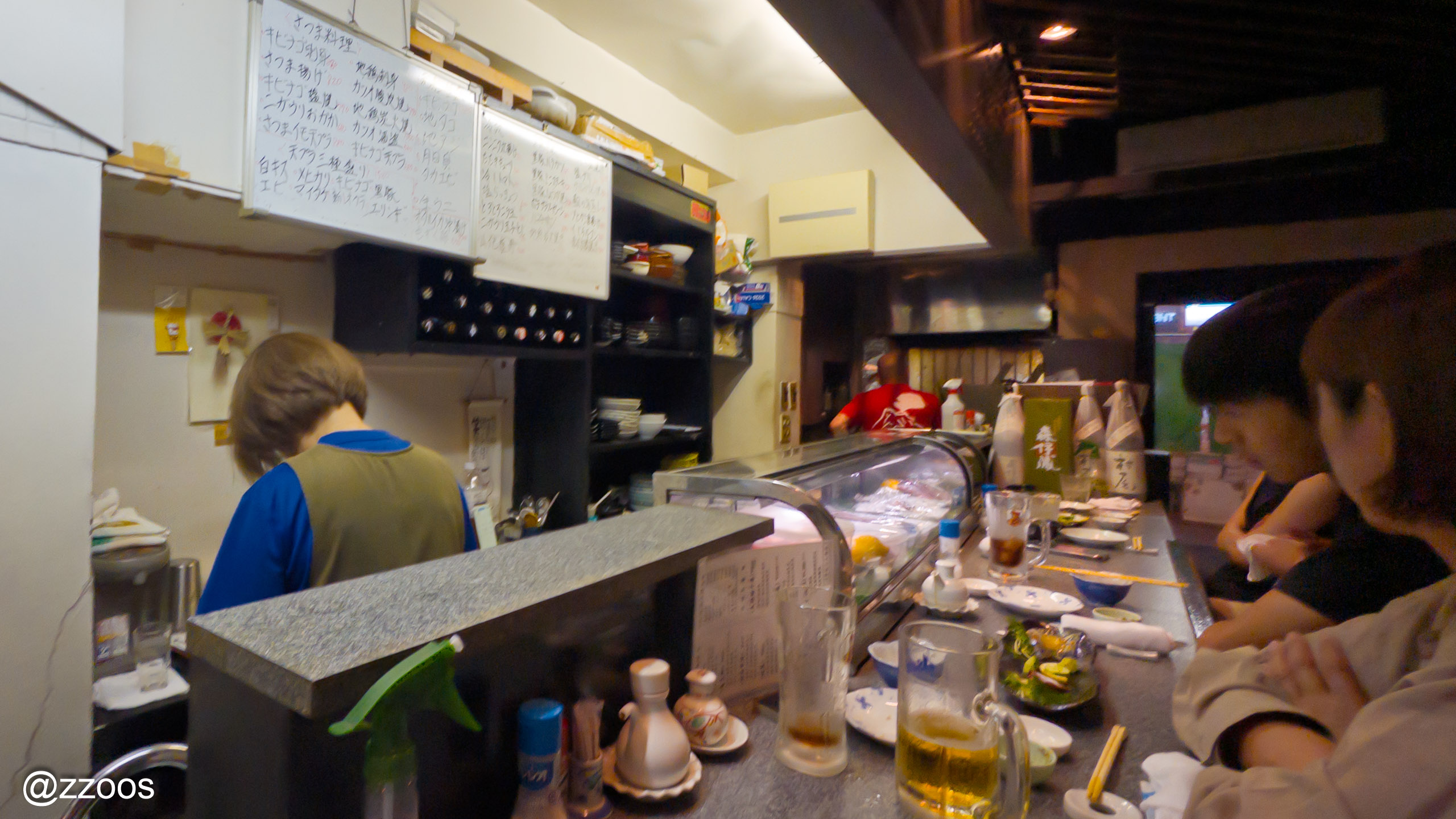 Two people working in the kitchen at Kaniya, Kagoshima