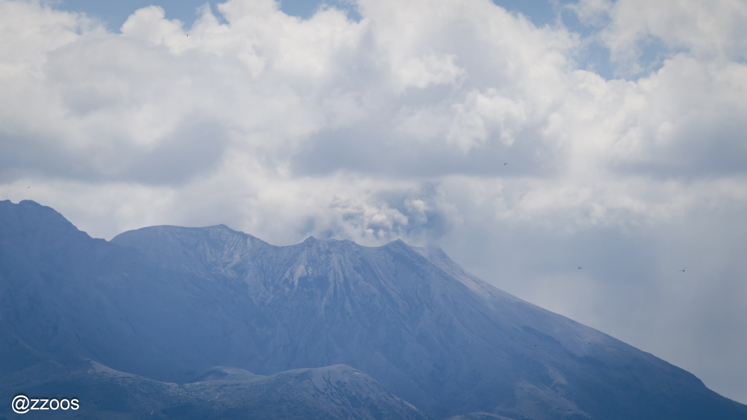 Gray volcanic smoke rising from the Minamidake crater on Sakurajima
