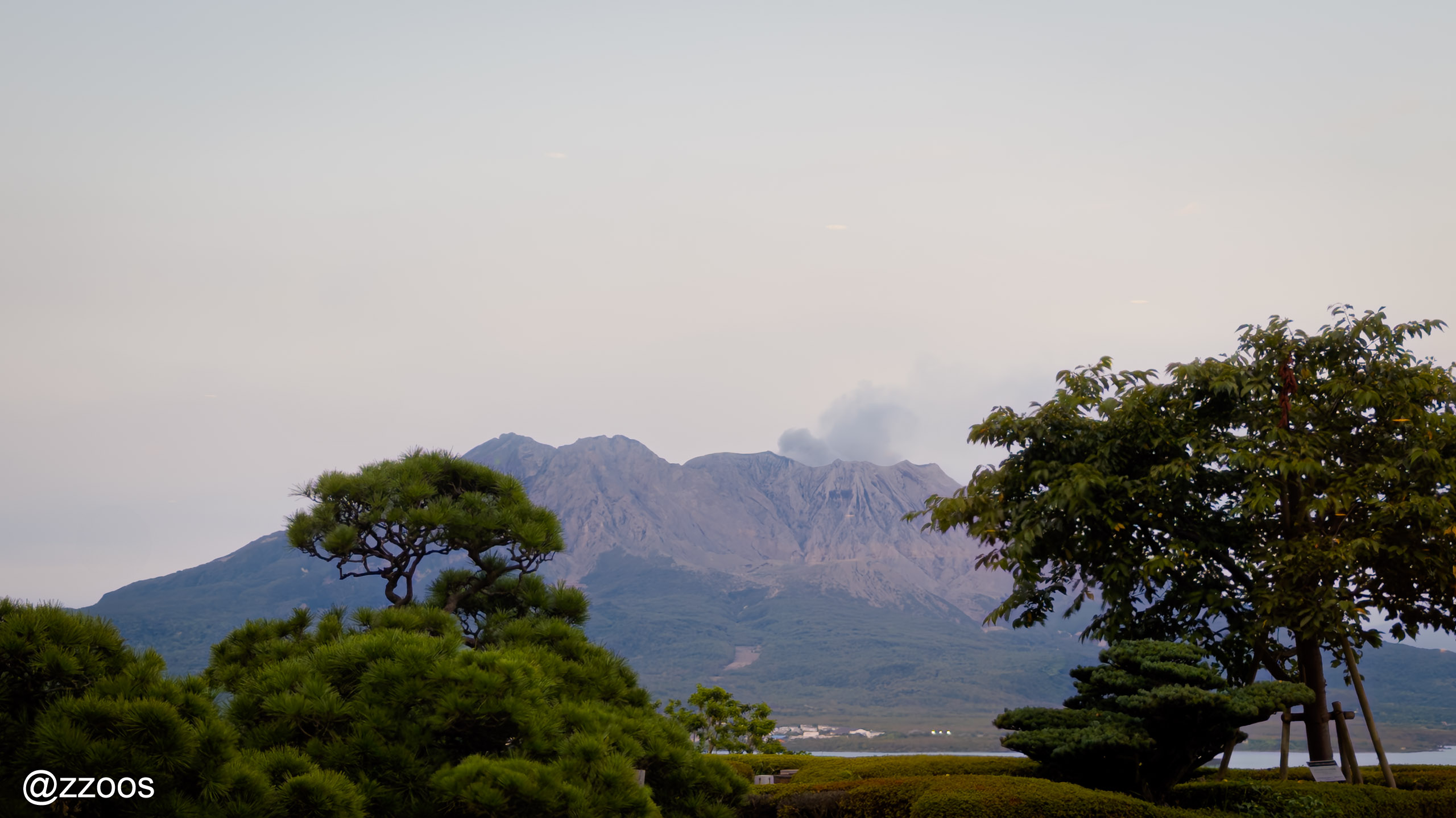 Sakurajima with clouds and smoke from its crater